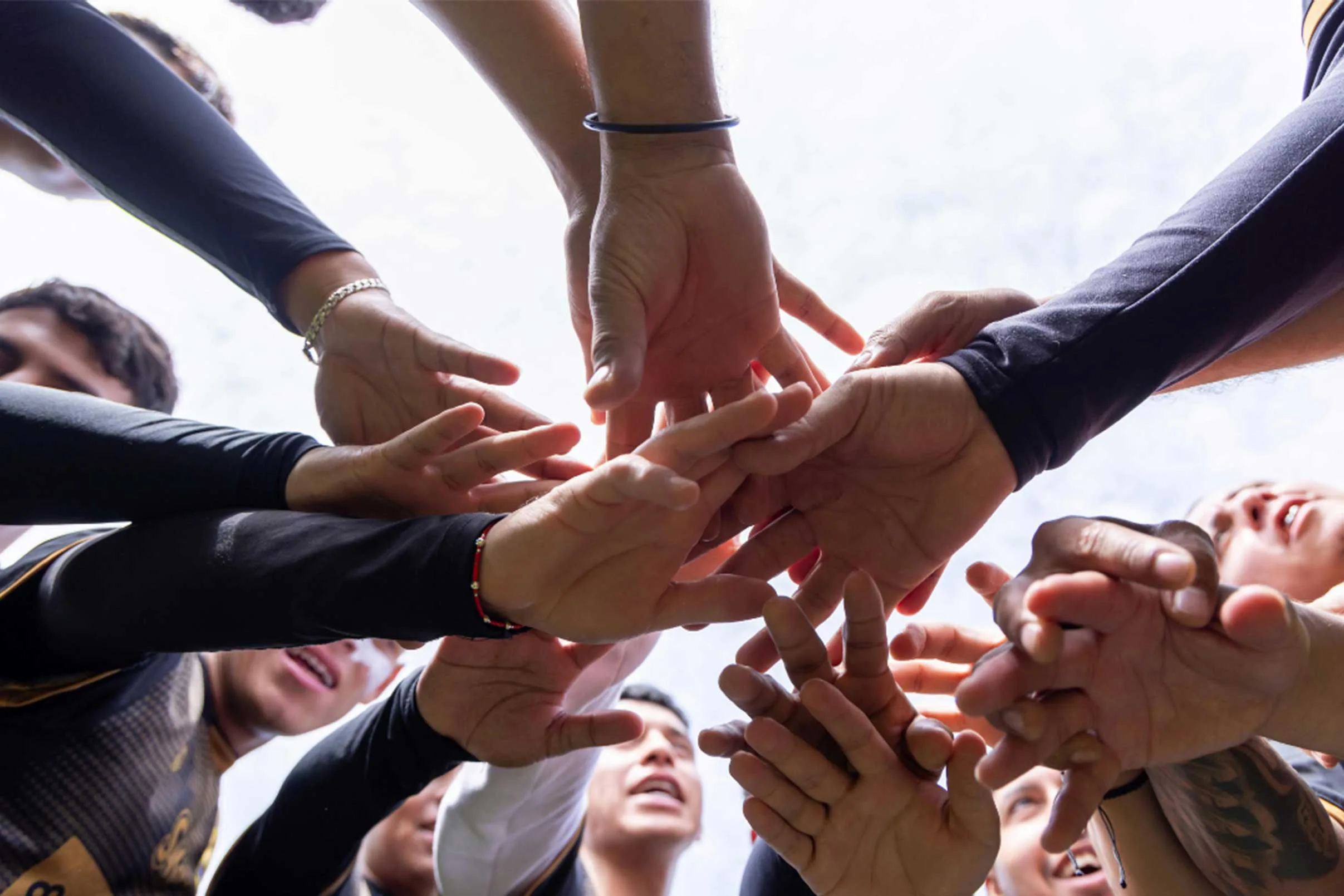 Sports team athletes in a huddle